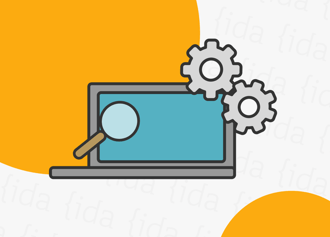 Notebook con una lupa y dos engranajes por encima de este.